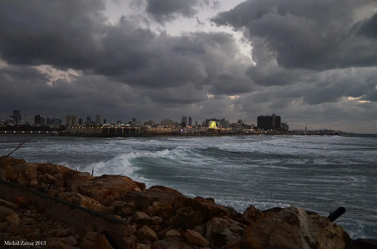 Tel Aviv's skyline across a rough sea, seen from the port